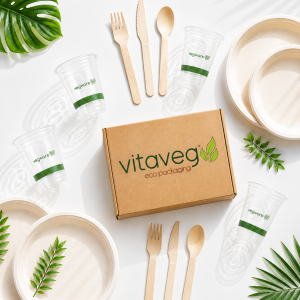 Eco Party Pack — compostable cups, bagasse plates and wooden cutlery arranged around a Vitaveg kraft box